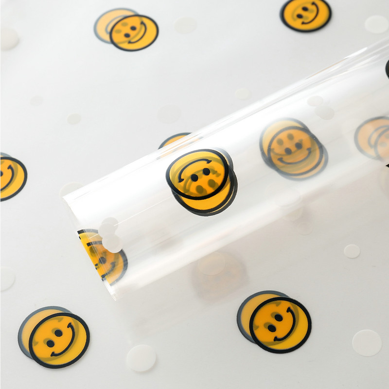Papel de embrulho de flores com rosto sorridente de celofane OPP